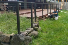 Aluminum railing over rocks to keep goat off the deck